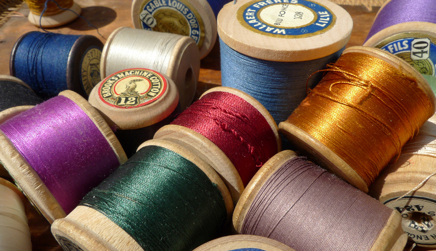 different coloured spools of thread