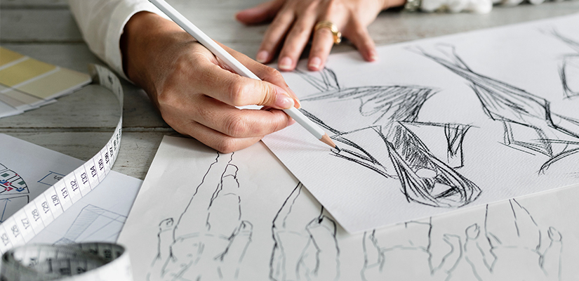 woman sketching pattern designs