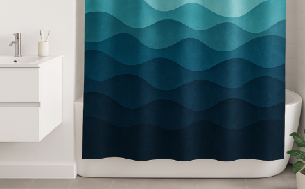 Modern bathroom with ocean-themed bath mat and shower curtain